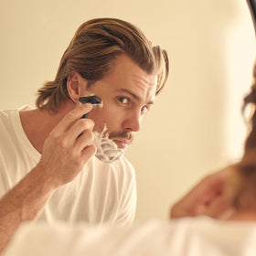 Henson Shaving 100-pack beside a ruler showing scale for long supply