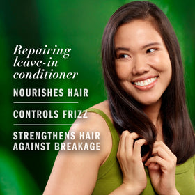 Herbal Essences being applied to damp hair to detangle and reduce frizz
