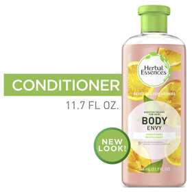 Herbal Essences bottle on bathroom shelf, suggests invigorating citrus shower benefit