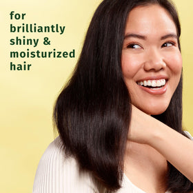 Herbal Essences chamomile pouring conditioner texture demonstrating creamy consistency and easy spread
