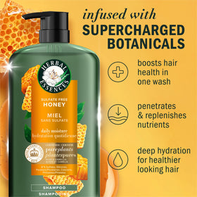 Herbal Essences pouring and lathering shampoo to show foam and easy spread