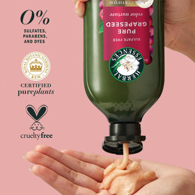 Person applying conditioner in shower showing Herbal Essences helps detangle and smooth