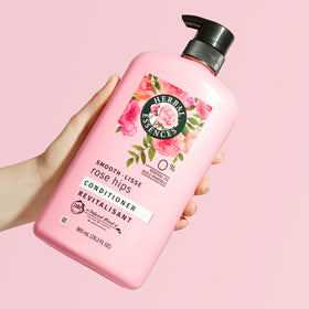 Herbal Essences model with shiny smooth hair after use showing gloss benefit