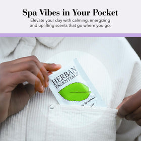 Herban Essentials wipes on a travel tray table conveying cleanliness and calming scent