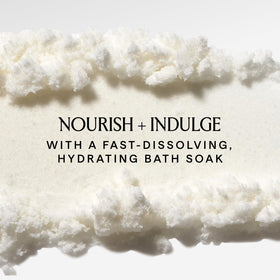 HERBIVORE pouring bath soak into tub water for soothing hydration