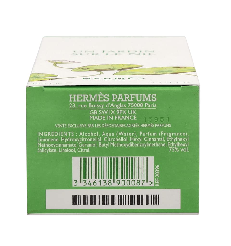Hermès bottle staged in a garden setting conveying fresh, green scent