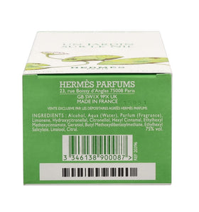Hermès bottle staged in a garden setting conveying fresh, green scent