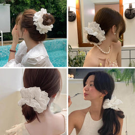 Heyiminy in a bridal flatlay suggesting polished accessory for special occasions