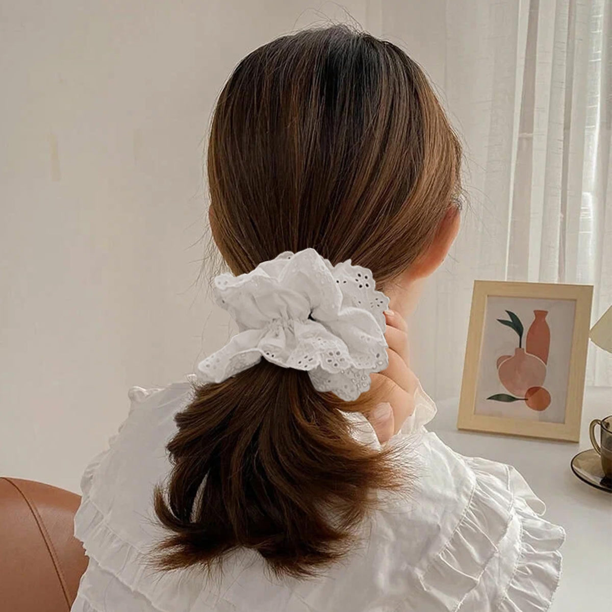 Heyiminy held in hand next to ruler to show 7-inch oversized scale