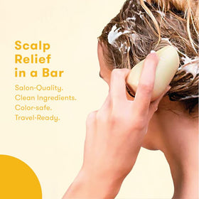 HIBAR Soothe resting on shower shelf illustrating travel-ready, waterless convenience