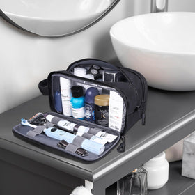 HILOMON toiletry bag in travel scene clipped to backpack for on-the-go convenience