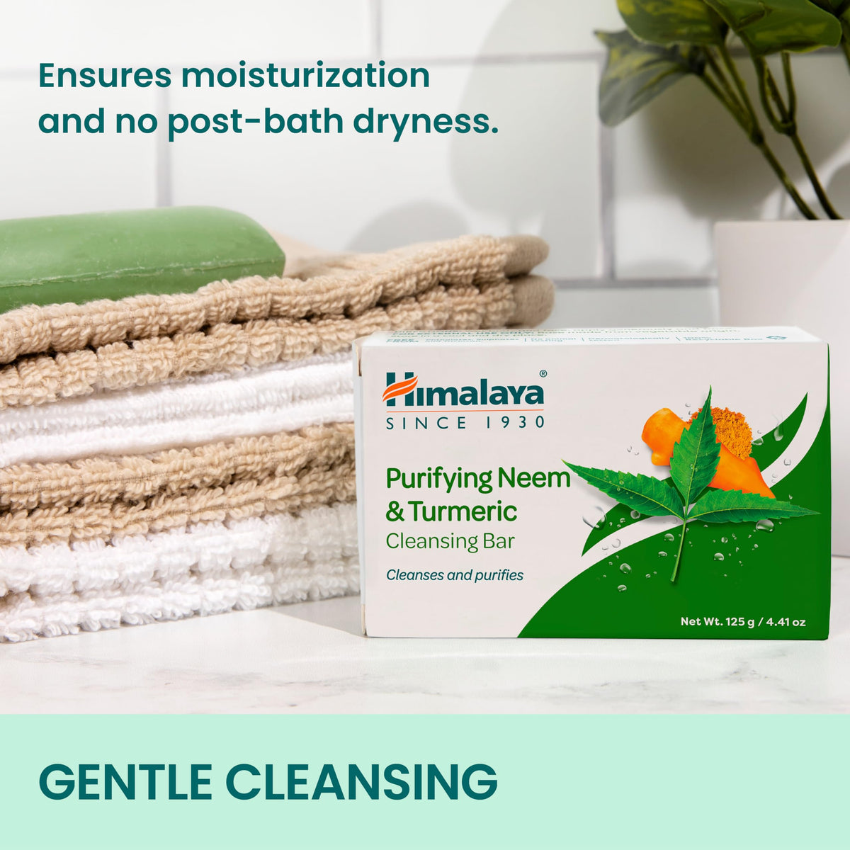 Himalaya soap held beside hand to show scale and convenient bar size benefit
