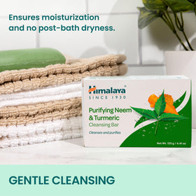 Himalaya soap held beside hand to show scale and convenient bar size benefit