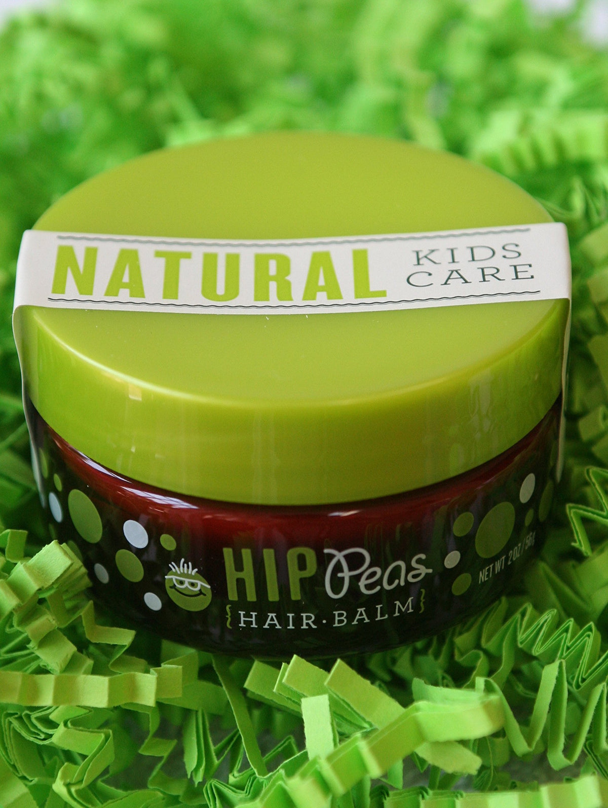Hip Peas jar next to a key for scale showing compact travel-friendly size