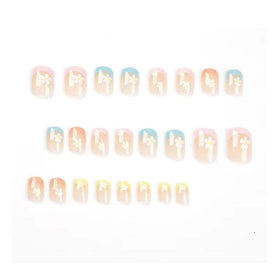 Hkanlre close-up of floral accent on square French tip for delicate detail
