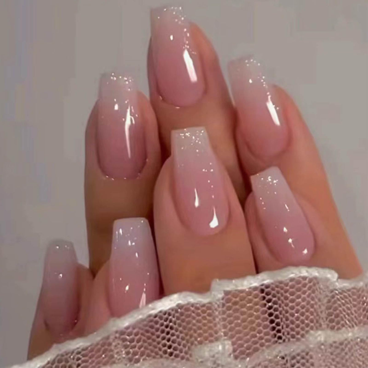 Hkanlre front packaging showing pink coffin press-on nails and included supplies for easy application