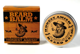 Man using Honest Amish balm styling beard, demonstrating softer, groomed facial hair