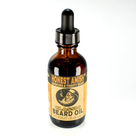 Honest Amish oil droplet close-up highlighting natural texture and absorption
