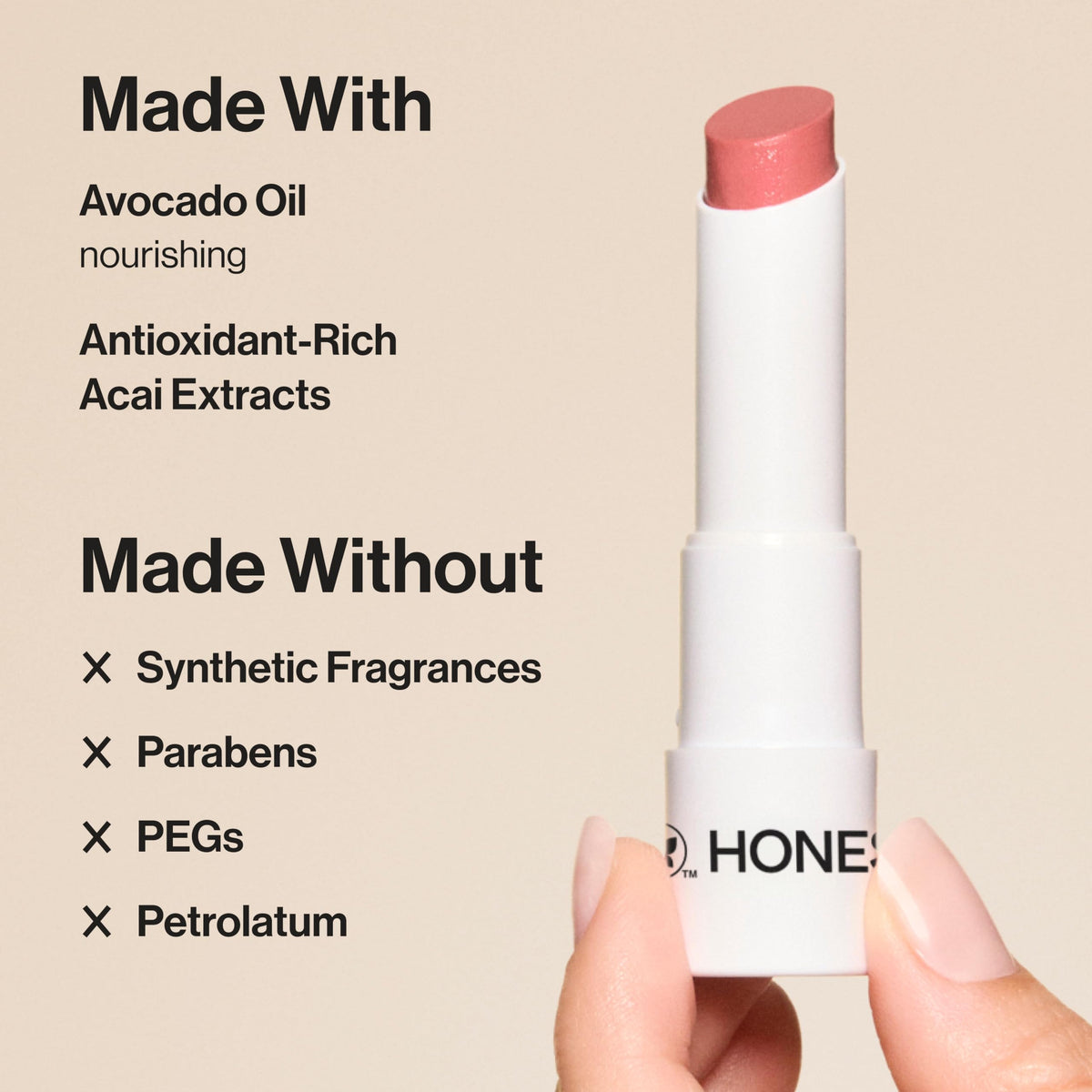Honest Beauty swatch on forearm displaying Fruit Punch coral-red payoff and buildability