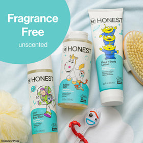 The Honest Company parent applying lotion to child in bathroom for gentle daily care
