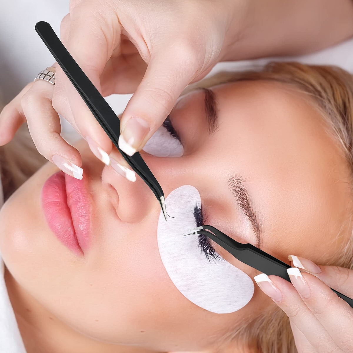 Honoson tweezers in use placing rhinestones showing accurate placement benefit