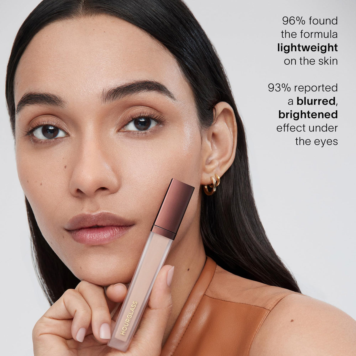 hourglass concealer tucked in a makeup bag for travel-friendly wear benefit