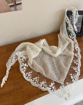 Huachi close-up of floral cutout lace showing texture and delicate detail