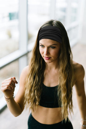 Huachi headband beside a hand for scale showing wide 5.5-inch coverage and fit versatility