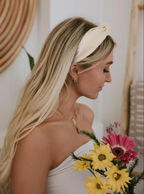 Huachi headband beside ruler showing scale and 2-inch width for stable, even pressure
