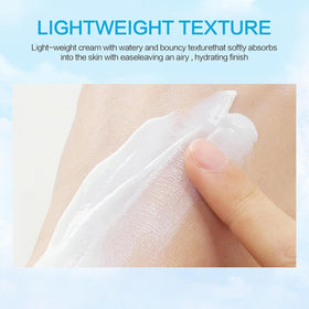 huxihom Centella sunscreen being spread on hand for smooth hydration benefit