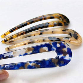 HYFEEL hair fork securing a classic bun, showing gentle no-pull hold