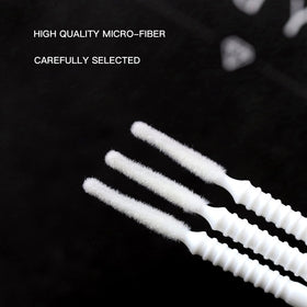 i-laesh brush in use applying adhesive to individual eyelash for control