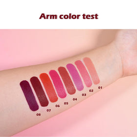 IATMOMOD lipstick on model in evening lighting showing bold maroon intensity