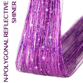 IDN BEAUTY braided hairstyle with tinsel accents adding shimmer and dimension
