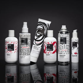 IGK size and scale with 5oz tube next to hand to show portable salon-ready amount
