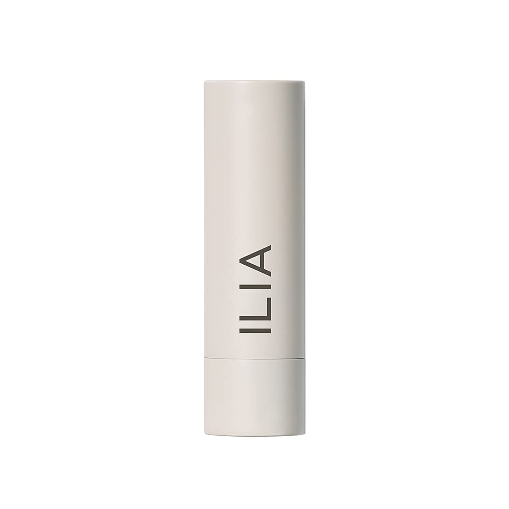 ILIA model applying Hold Me tint showing warm peachy nude and easy wear