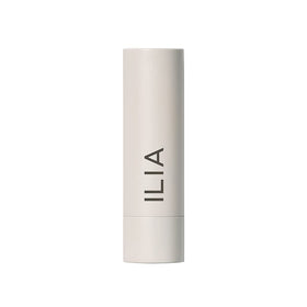 ILIA model applying Hold Me tint showing warm peachy nude and easy wear