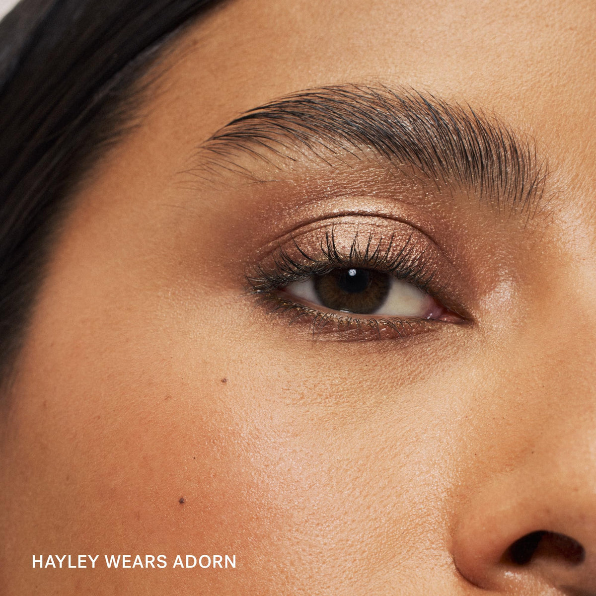ILIA Eye Stylus texture swatch on skin demonstrating blendable, shimmer finish benefit