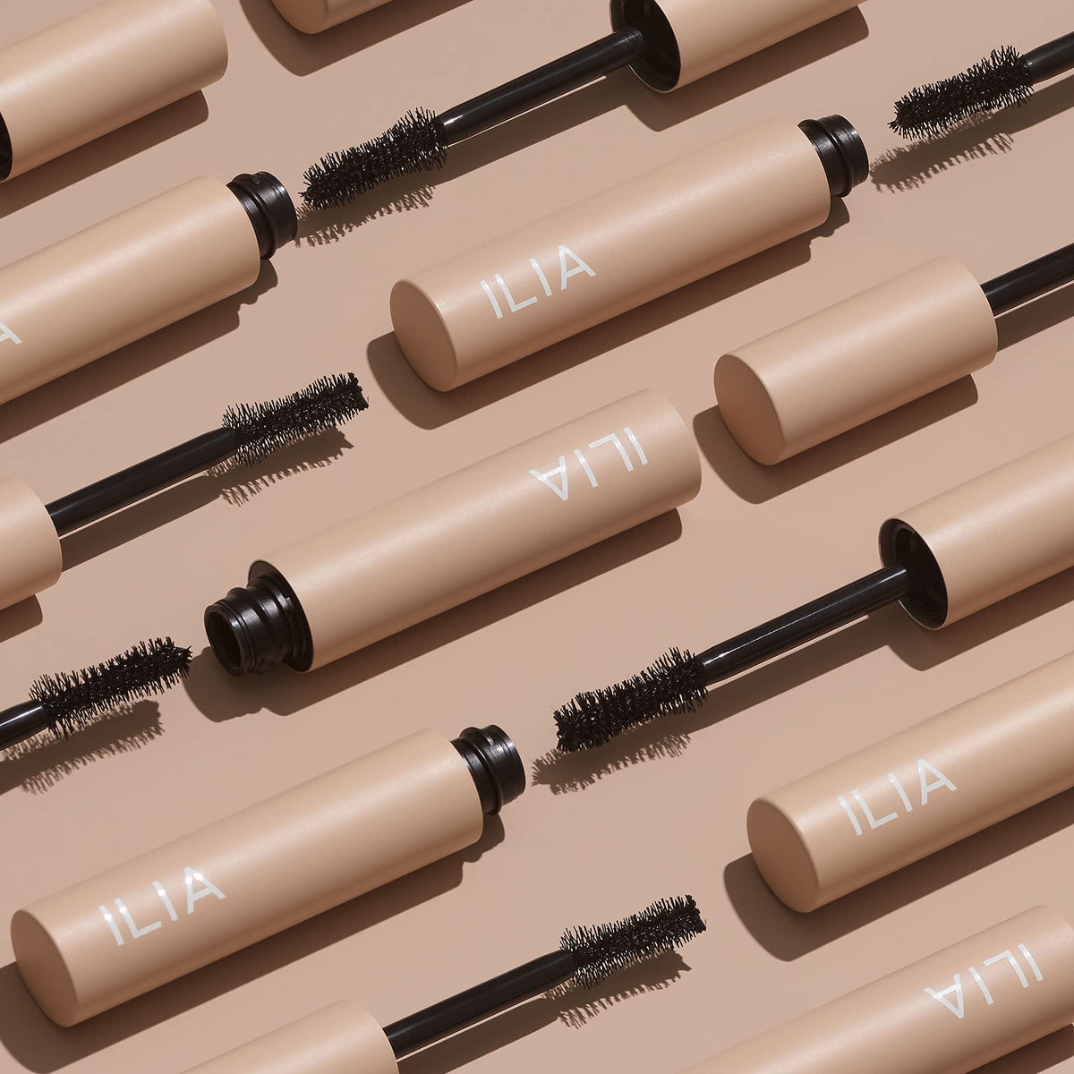 ILIA wand applying mascara to lower lashes for precise definition and no clumps