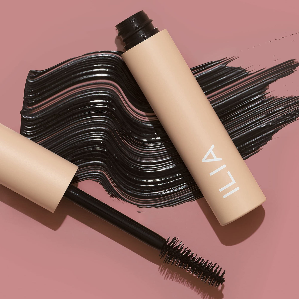 ILIA open tube with glossy formula on wand illustrating even product pickup