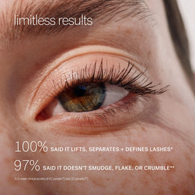ILIA tube next to fingers showing compact size and travel-friendly benefit