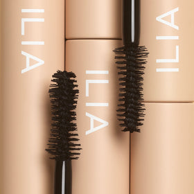 ILIA model wearing mascara demonstrating natural, lifted lashes suitable for sensitive eyes