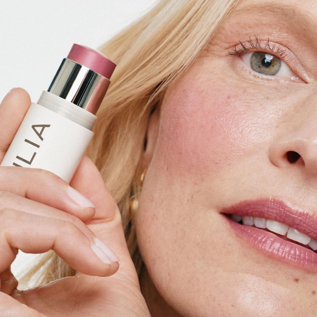 ILIA applied on cheeks in lifestyle shot providing natural glow and fresh color