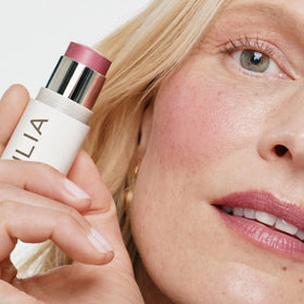 ILIA applied on cheeks in lifestyle shot providing natural glow and fresh color