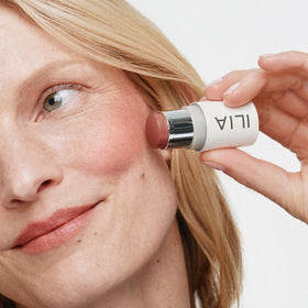 ILIA multi-stick on lips close-up showing buildable color benefit