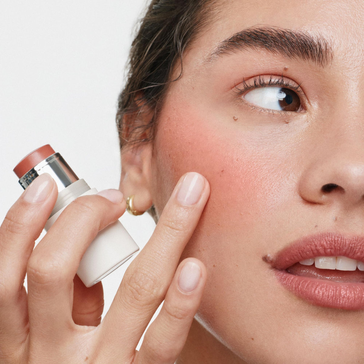 ILIA multi-stick creamy texture close-up demonstrating blendable finish