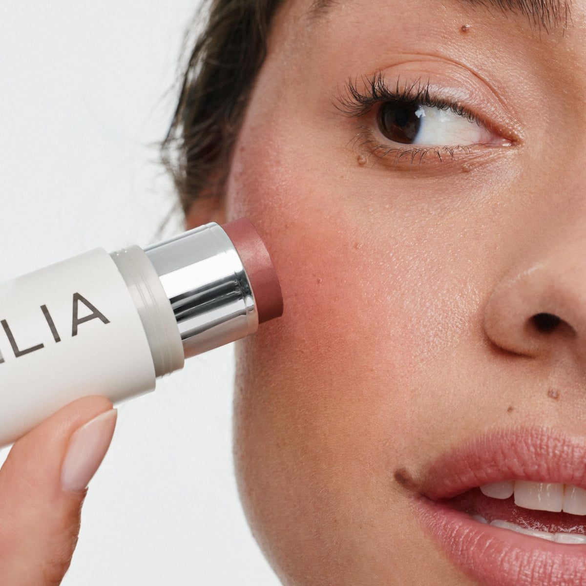 ILIA creamy texture swiped on skin illustrating blendability and natural finish benefit