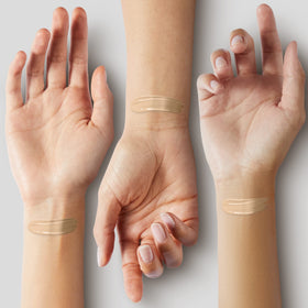 ILIA arm swatches of Bom Bom ST5 displaying light neutral coverage options