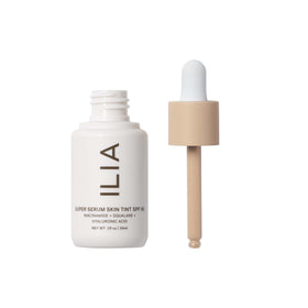 ILIA texture close-up of dewy drops, highlighting smooth hydrating finish