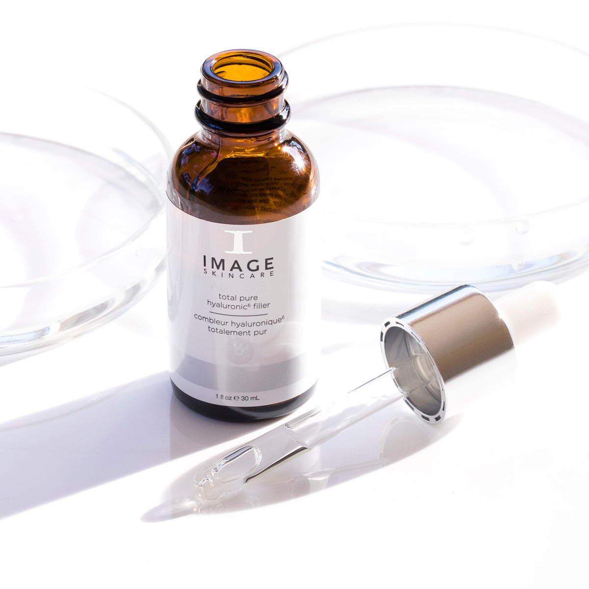 IMAGE Skincare 1 fl oz bottle in hand showing compact travel-friendly size